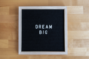 board with dream big word