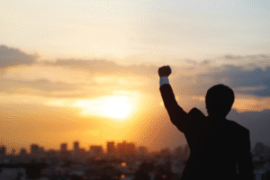 man facing sunset