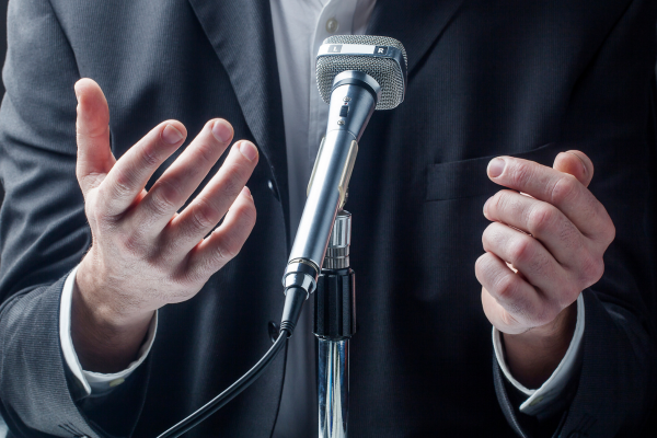 Sales professional analyzing wrist body language cues to understand buyer confidence and hesitation.