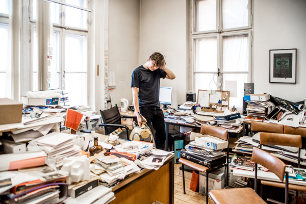 Professional practicing mindfulness breathing exercise at desk to reduce stress