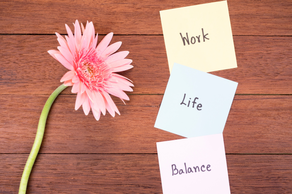 Professional practicing mindfulness breathing exercise at desk to reduce stress