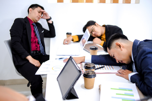 Common signs of burnout including fatigue and stress in the workplace