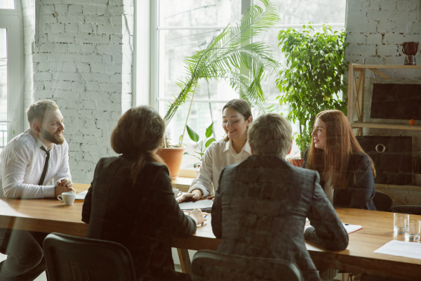 Professional handling criticism during a workplace meeting
